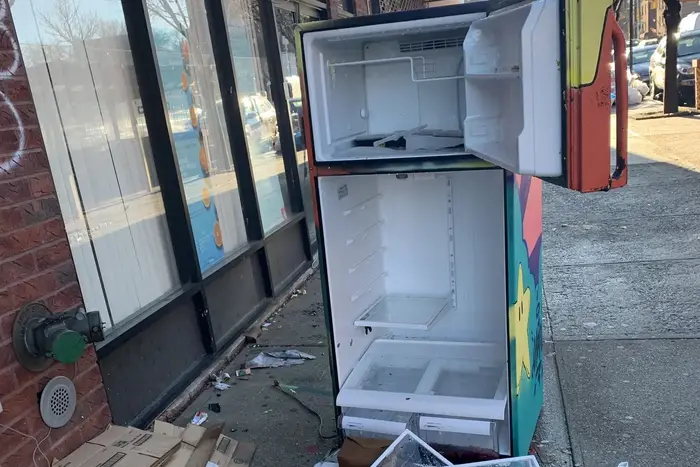 A community refrigerator set up outside the office of a state Senator in Queens was found destroyed with its freezer and fresh food doors ripped open.